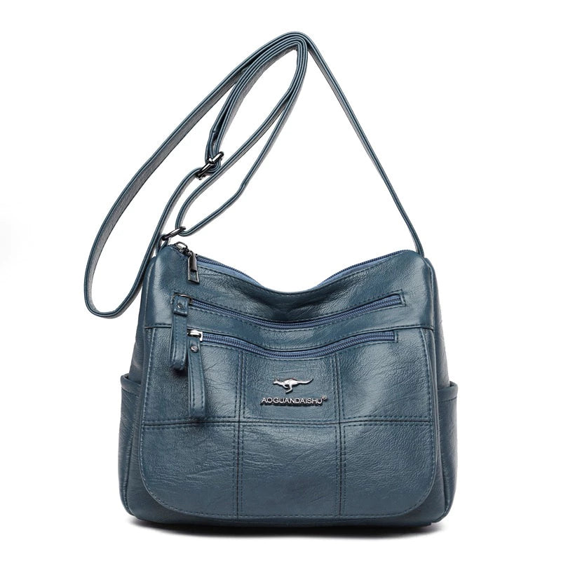 Bolsa feminina transversal Bali azul de couro sintético vista de frente