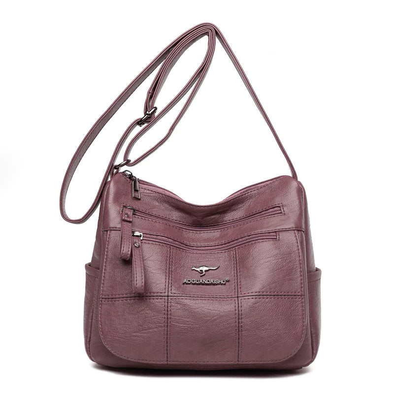 Bolsa feminina transversal Bali rosê de couro sintético vista de frente