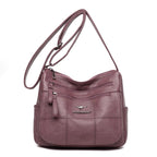 Bolsa feminina transversal Bali rosê de couro sintético vista de frente
