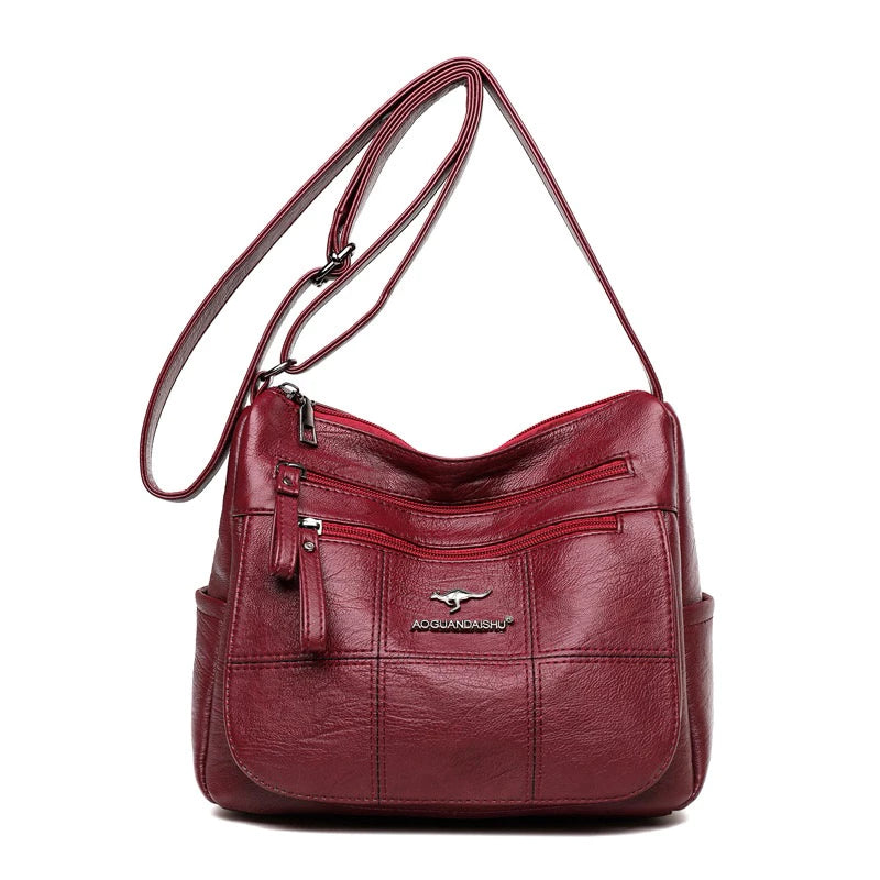 Bolsa feminina transversal Bali vermelha de couro sintético vista de frente