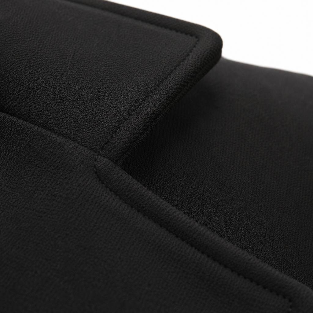 Textura da lã batida do blazer preto